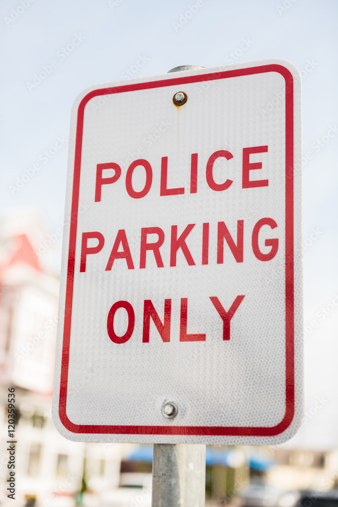 Police parking only street sign in red Police parking only street sign in red