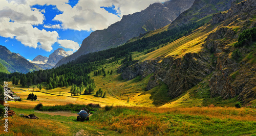 Alpien meadows with golden rays of sun photo