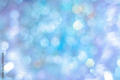 Blurred blue background with bokeh lights
