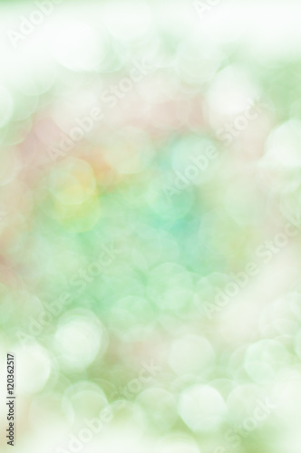 Blurred pale green background with bokeh lights