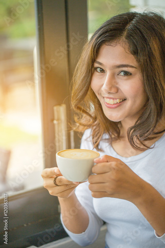 asian woman drinking coffee in relax time