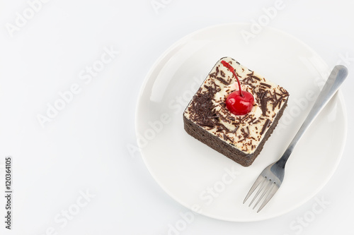 Chocolate cake with cherries on white background