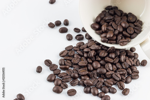 Roasted Coffee beans on a white background. © saartpinta