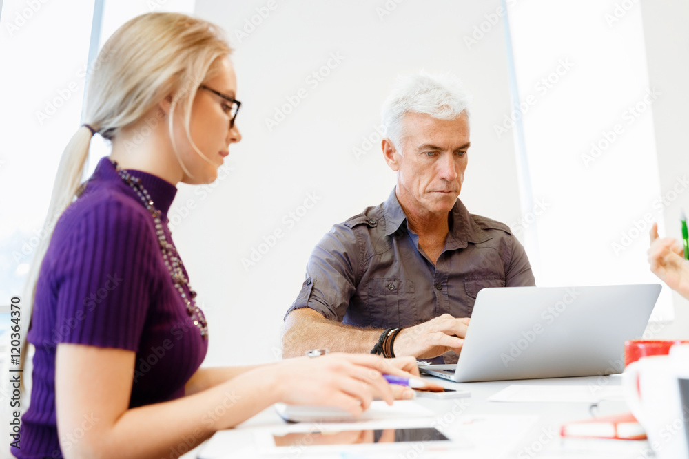Co-workers working together Co-workers working together