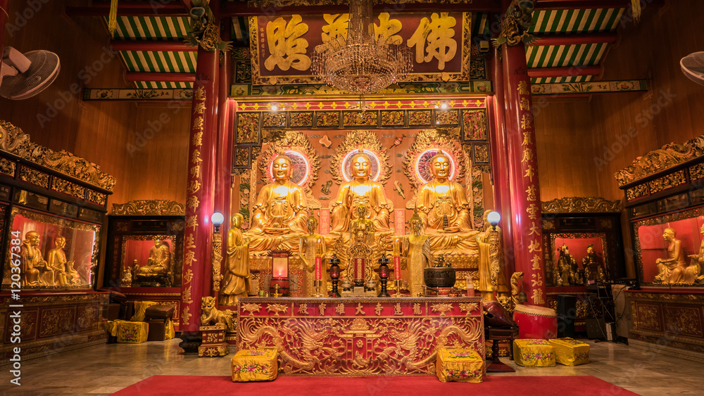 Three Buddha gold statue chinese style and chinese art architecture in Wat Leng Nei Yee Chinese temple in Yaowarat road,Bangkok capital city,Thailand.