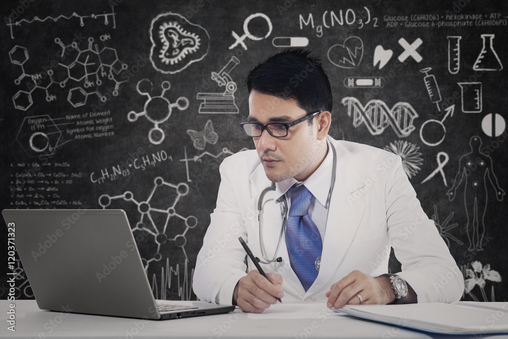 Physician with laptop and doodles Physician with laptop and doodles