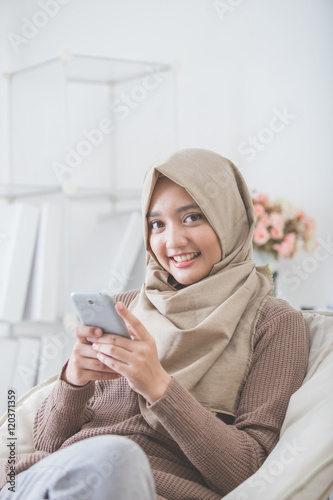 happy asian woman using mobile phone