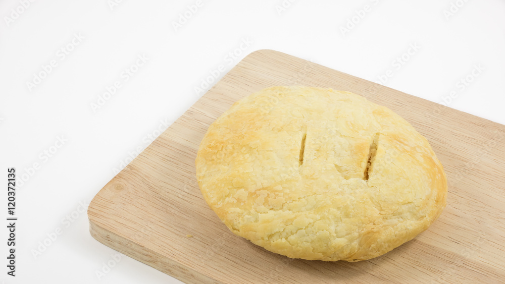 The Taiwanese sun cake (milk butter pastry) on the brown wooden plank.