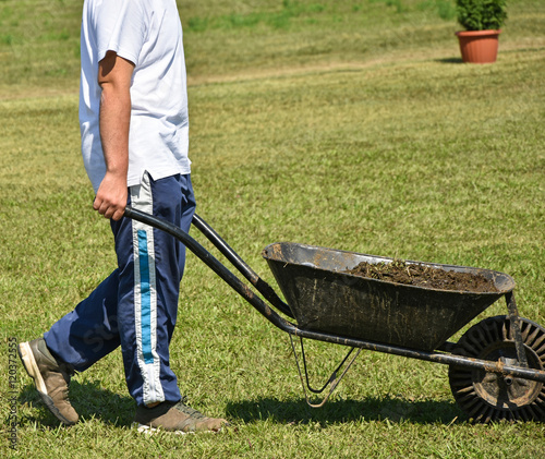 Worker with wheelbarrow