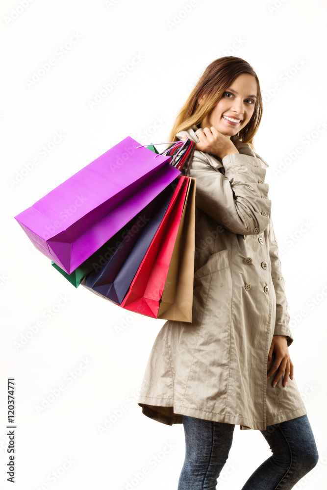 Young woman on autumn sale with colorful bags. Young woman on autumn sale with colorful bags.