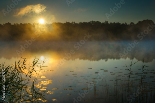Sun rises over Sawinda Wielka Lake. Masuria. Poland.