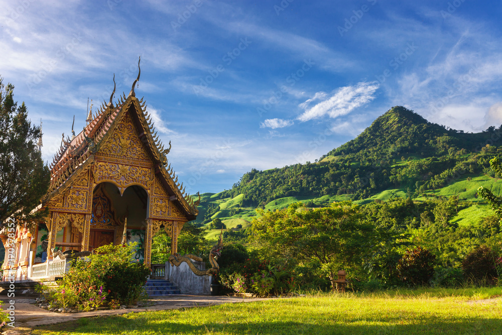 Temple in Thailand near mountain valley during sunrise Natural s