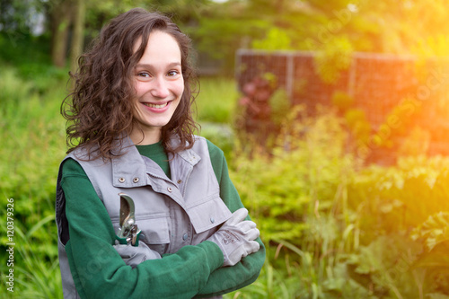 Portrait of a woman city public worker in a garden