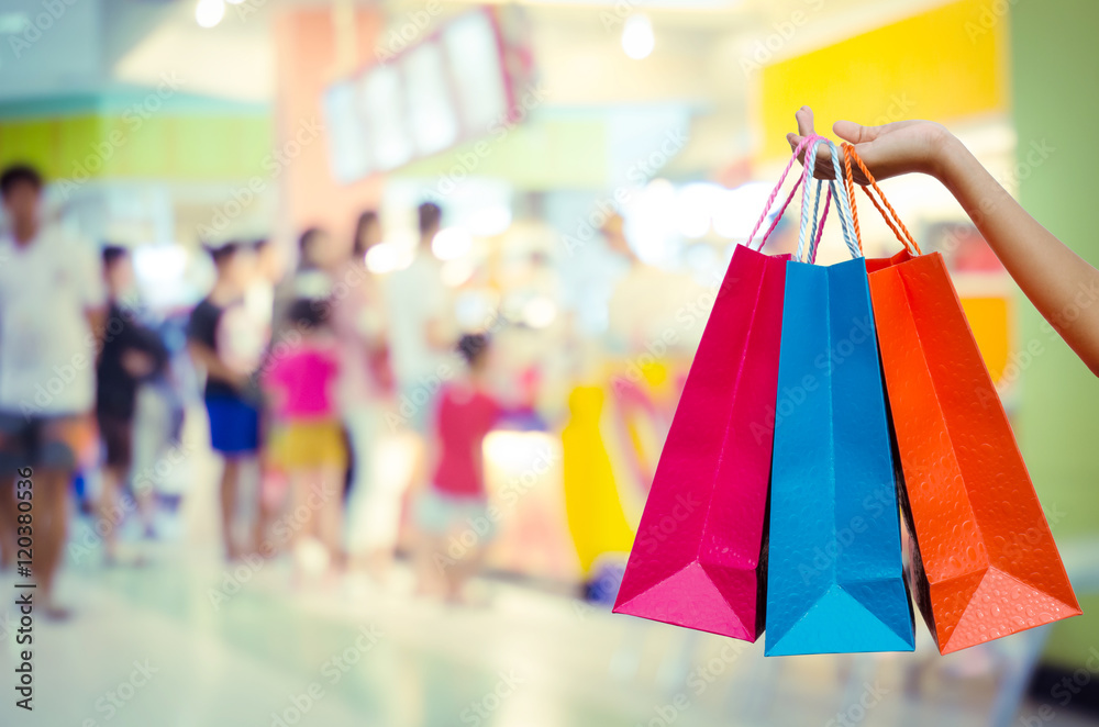 Woman with shopping bags in shopping mall Woman with shopping bags in shopping mall