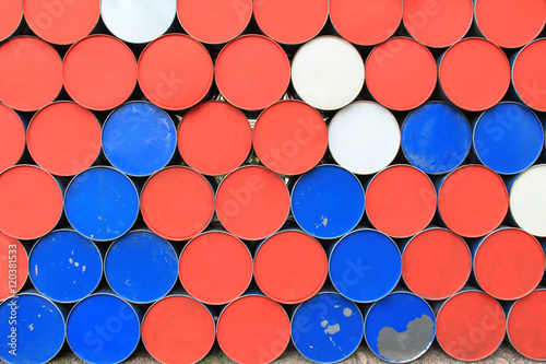 Large metal barrels stacked in a row