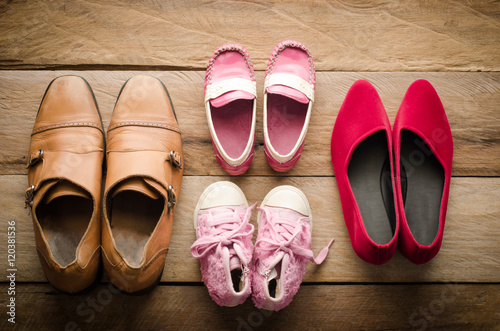 shoes, four pairs of dad, mom, daughter and son - the family concept