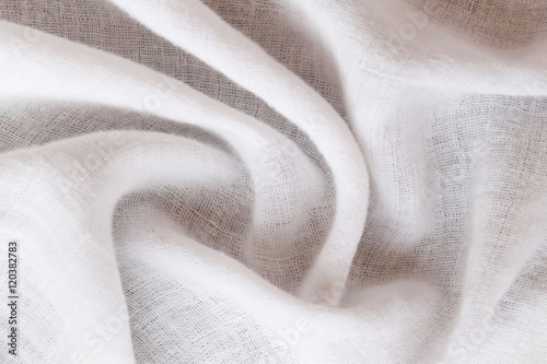 rippled white calico of surface fabric.
