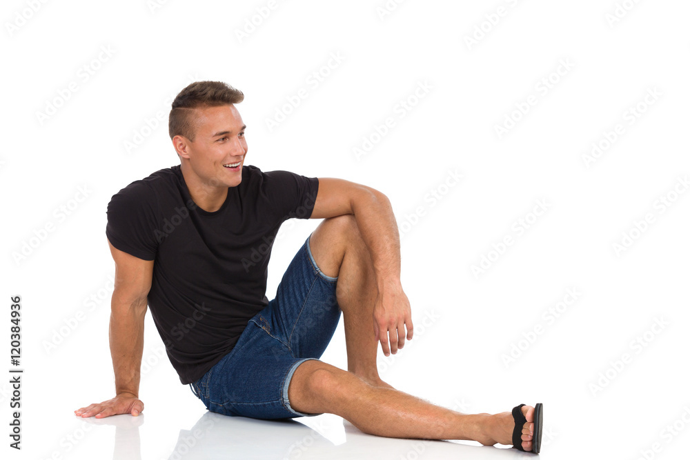 Handsome Young Man Sitting Relaxed On Floor Handsome Young Man Sitting Relaxed On Floor