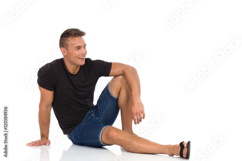 Handsome Young Man Sitting Relaxed On Floor