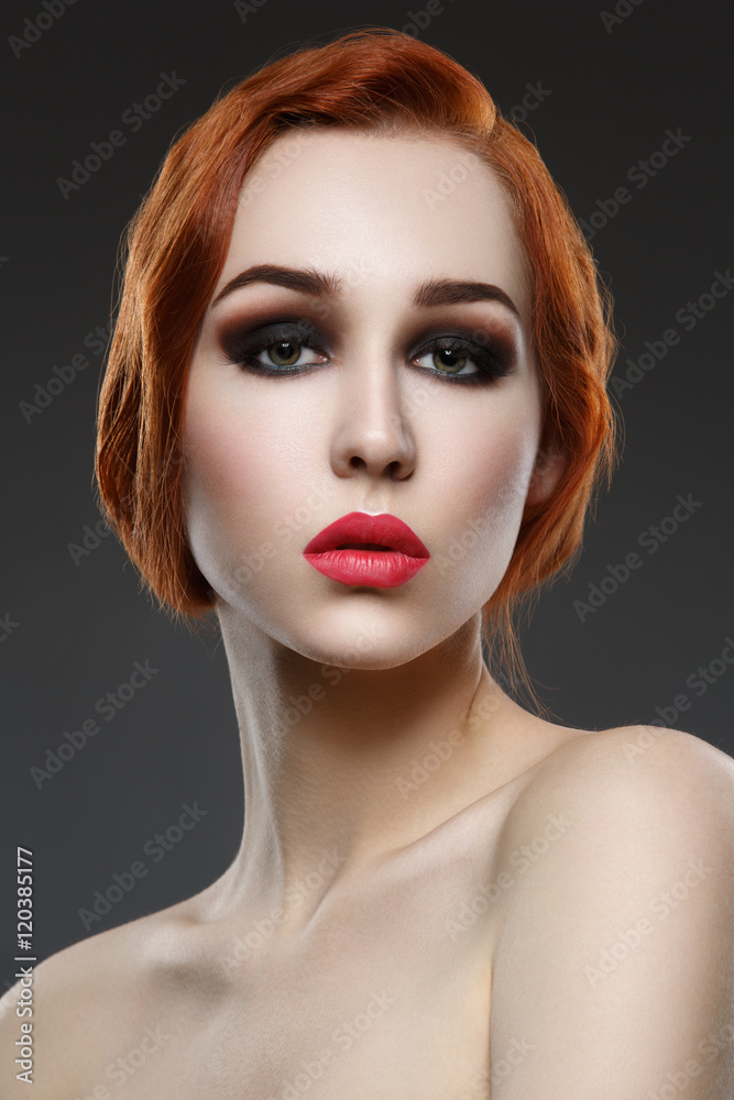 Beautiful girl with smoky eyes and red lips
