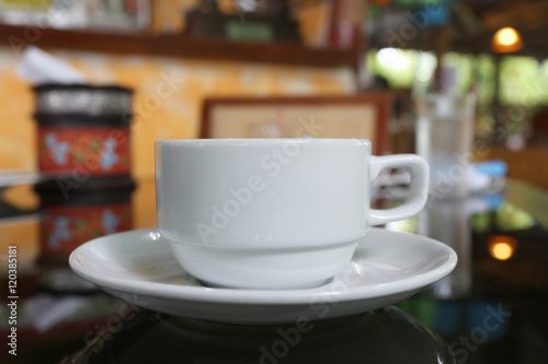 White coffee cup placed on the foods table.