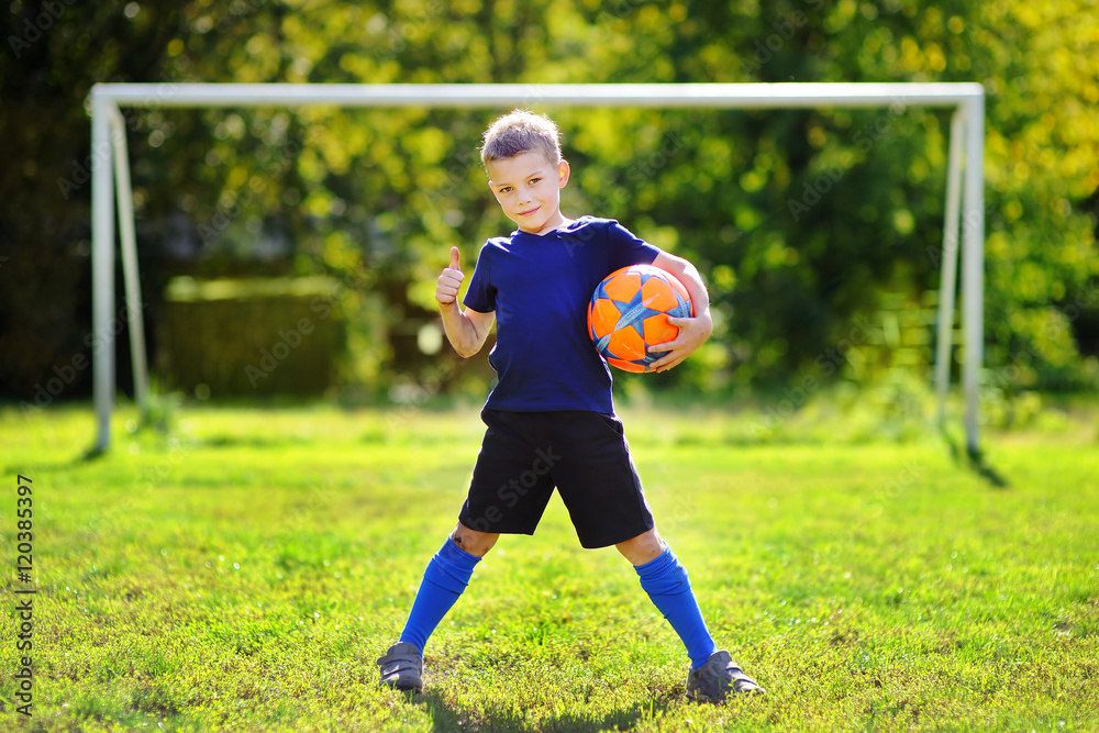 Little boy having fun playing a soccer game
