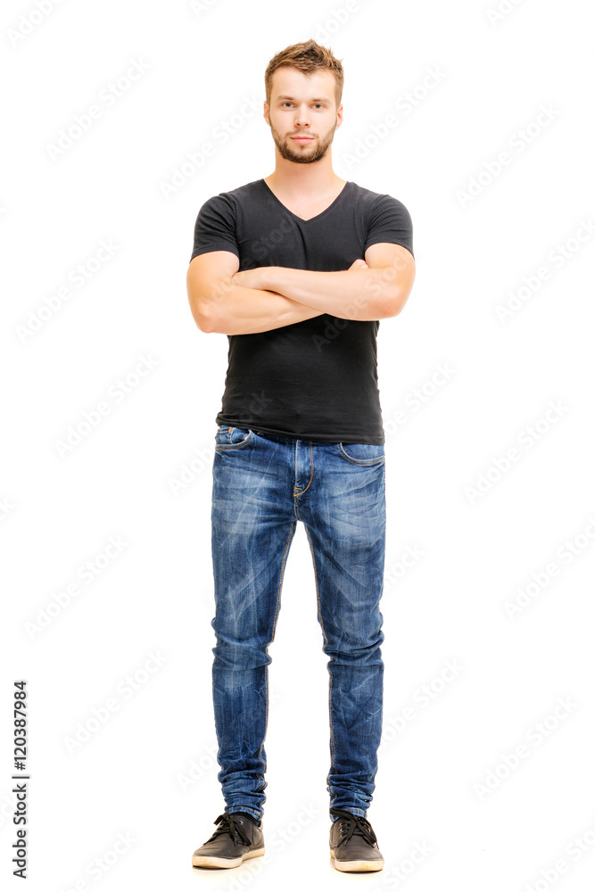 Handsome confidence. Studio full length portrait of young man in casual wear with hands crossed. Isolated on white. Handsome confidence. Studio full length portrait of young man in casual wear with hands crossed. Isolated on white.