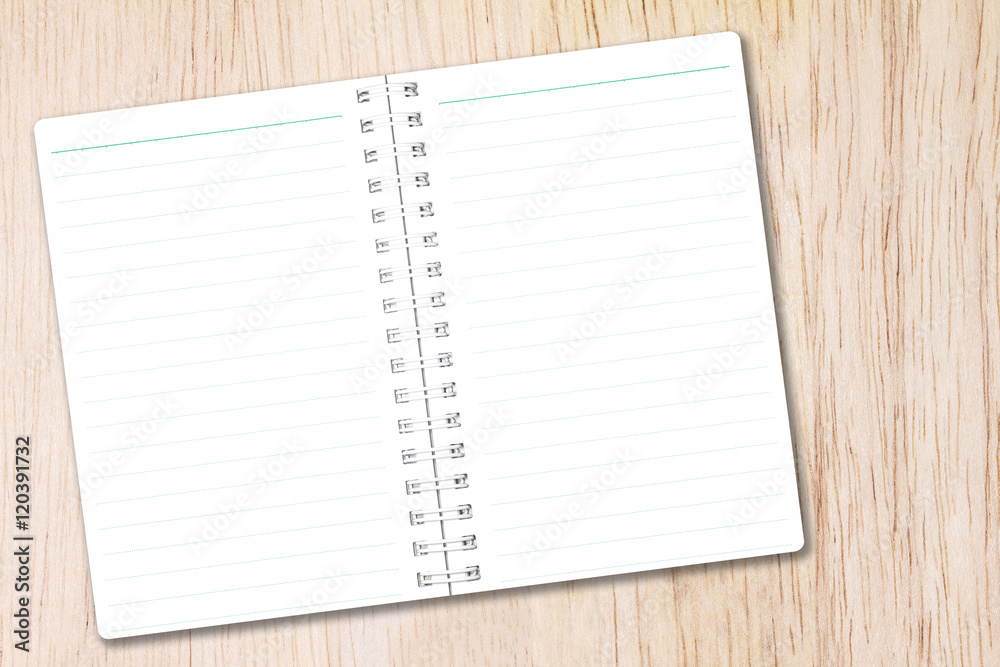Open notebook paper with line on nature wood background for design with copy space for text or image. Open notebook paper with line on nature wood background for design with copy space for text or image.
