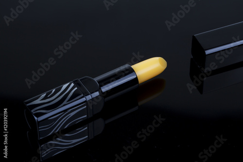 Yellow Lipstick on the black background
