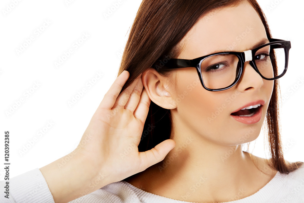 Shocked young woman overhearing a conversation Shocked young woman overhearing a conversation