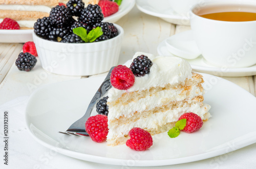 Layer walnut cake with cream and berries