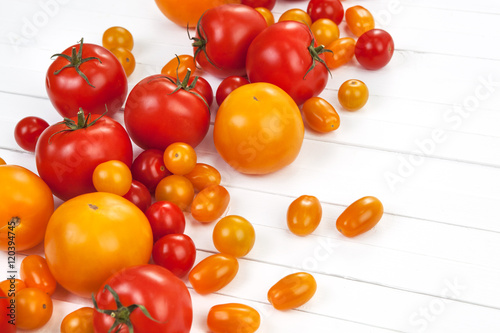 Wallpaper Mural Colorful tomatoes on white background Torontodigital.ca