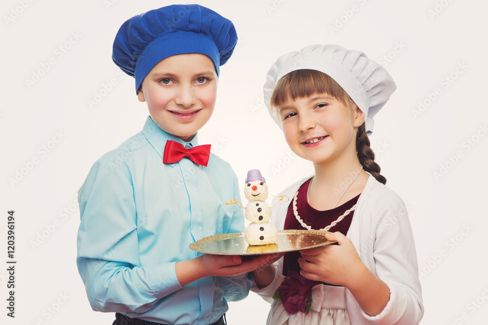 Children holding christmas dessert Children holding christmas dessert