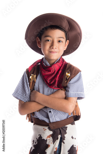 Little boy in cowboy costume on white background