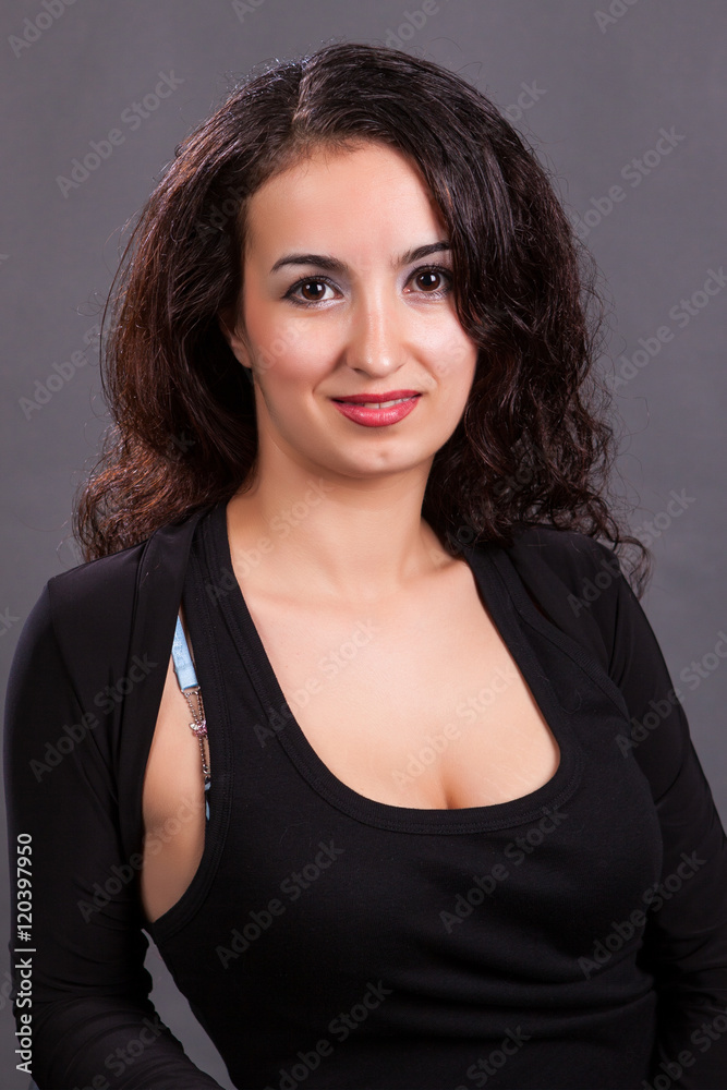 brunette on a gray background photographed in studio brunette on a gray background photographed in studio