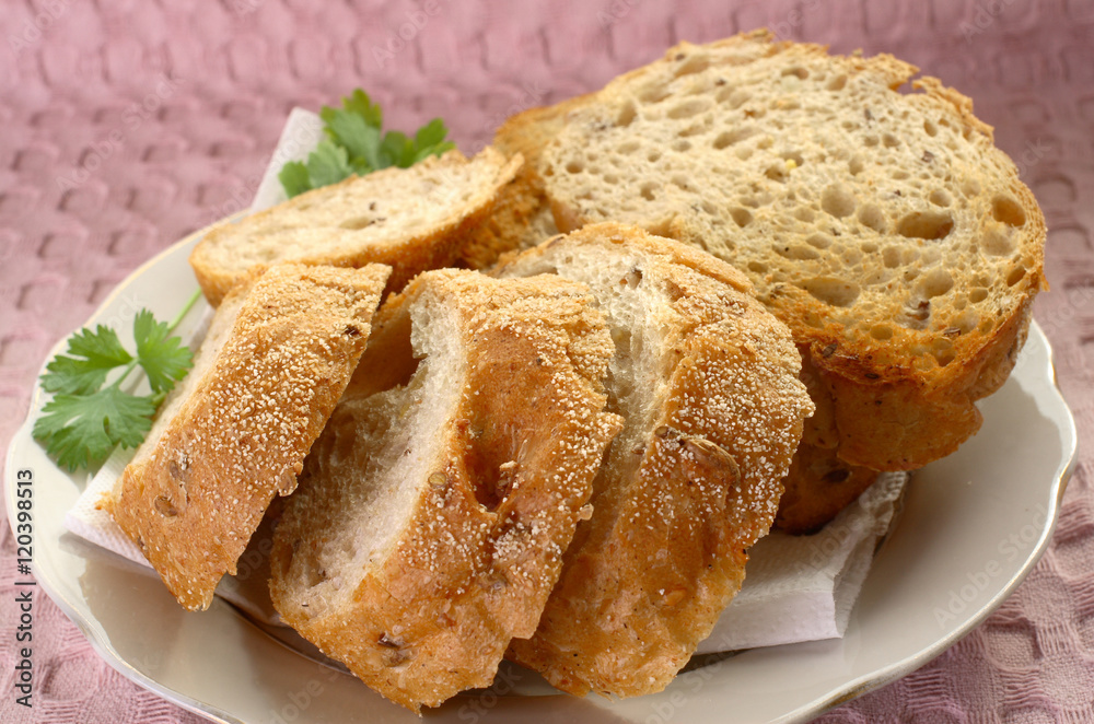 Fototapeta premium Sliced bread on a white plate
