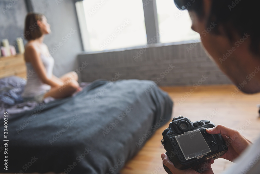 professional photo camera in hands of photographer professional photo camera in hands of photographer