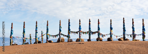 Traditional wooden poles to the hitching post serge. Prayer flags on Olkhon, Buryat Region, Russia, Siberia.