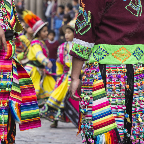 Peruvian dancers at the parade in Cusco. People in traditional clothes.