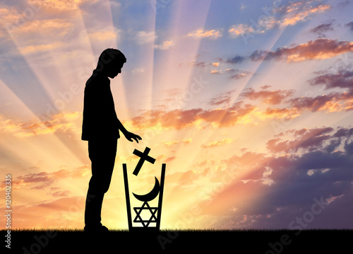 Man atheist throws all religions in the trash photo