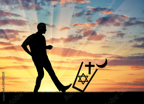 Man atheist throws all religions in the trash and kick it