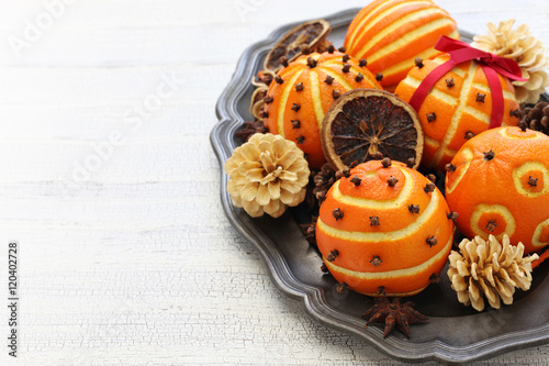 spiced orange pomander balls, scented christmas table decoration photo