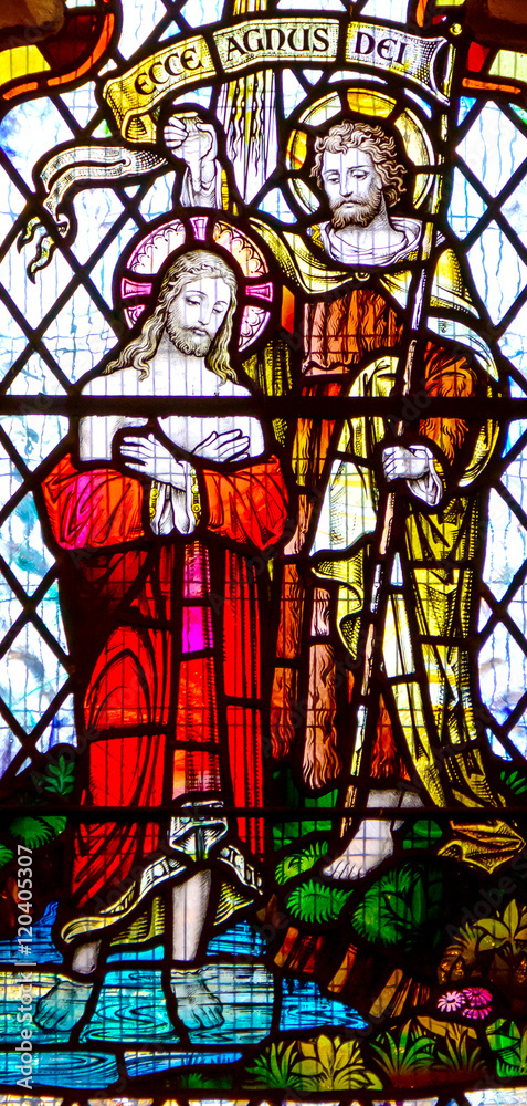 The baptism of Jesus on Jordan, by John the Baptist. Church stained glass window
