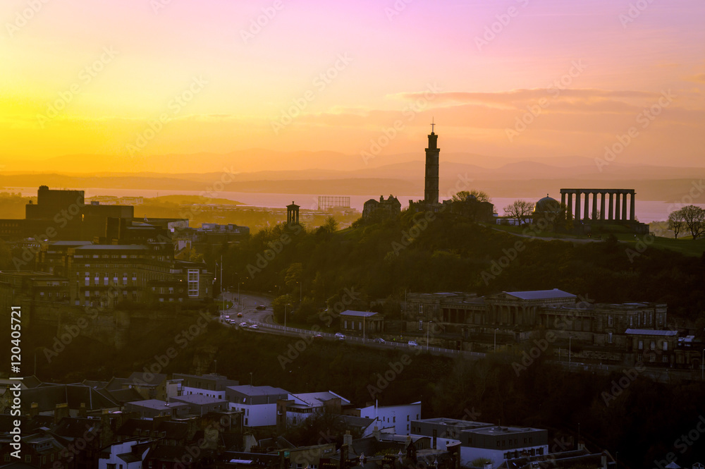 Foggy sunset over the silhouette of Edinburgh cityscape skyline