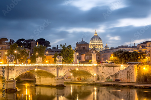 Rome and Vatican, cityscape at night, with St peter's basilica and bridge over the river Tiber