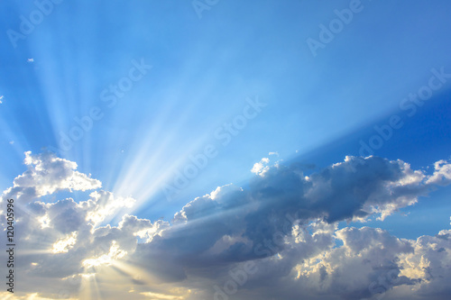Sun beams or light rays breaking through the clouds. Beautiful s photo