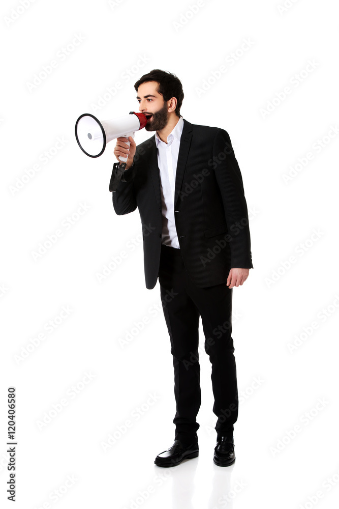 Fototapeta premium Businessman shouting using a megaphone.