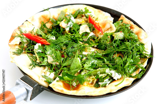 Thin armenian pita bread with cheese, pepper and herbs