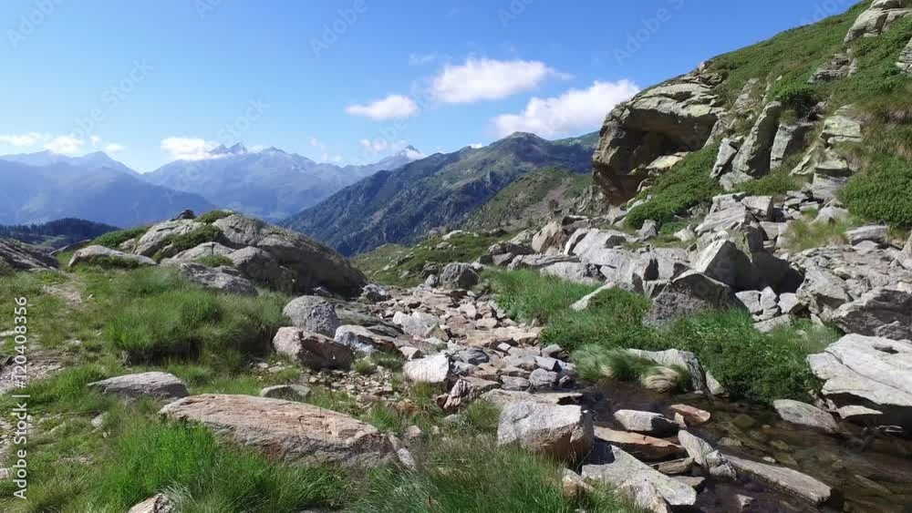 hiking, walking, trekking outdoors on mountain trail path toward river in sunny day, 4k front pov (point of view) hiking, walking, trekking outdoors on mountain trail path toward river in sunny day, 4k front pov (point of view)