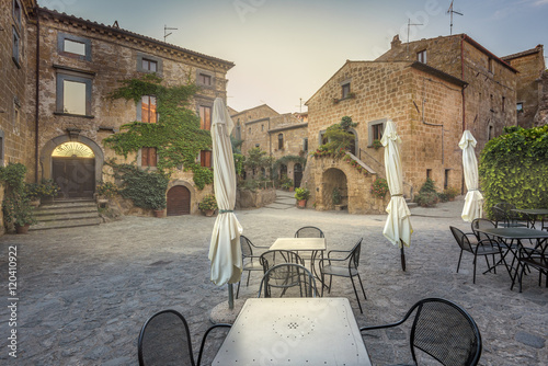 Fototapeta Naklejka Na Ścianę i Meble -  Deserted streets and restaurant in the ancient town of Italy.